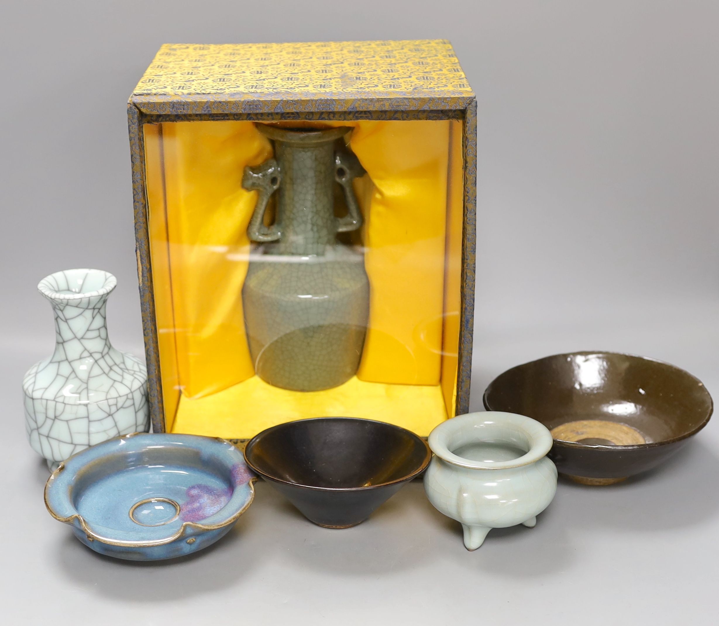 A group of Chinese monochrome ceramics, comprising two crackle glaze vases, tallest 21 cm, one cased, a Jun type dish and tripod censer a leaf impressed bowl and another bowl